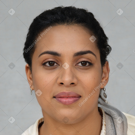 Joyful latino young-adult female with short  brown hair and brown eyes