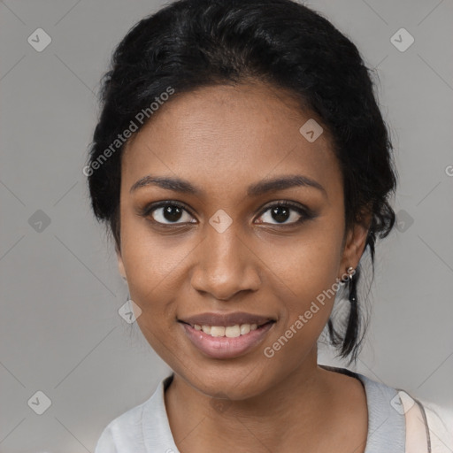 Joyful black young-adult female with medium  black hair and brown eyes