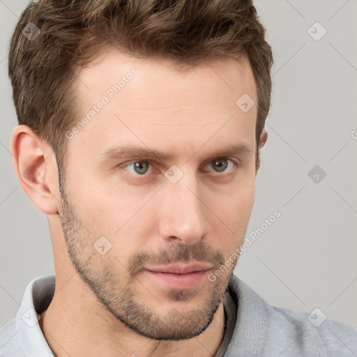 Neutral white young-adult male with short  brown hair and grey eyes