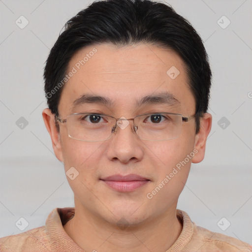 Joyful asian young-adult male with short  brown hair and brown eyes