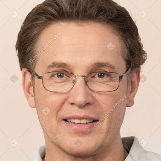 Joyful white adult male with short  brown hair and brown eyes