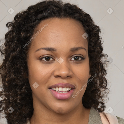 Joyful black young-adult female with medium  brown hair and brown eyes