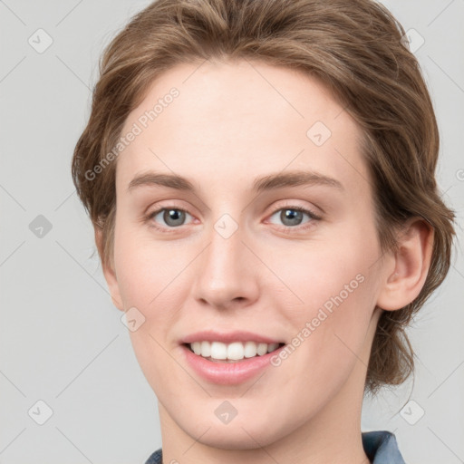 Joyful white young-adult female with medium  brown hair and blue eyes