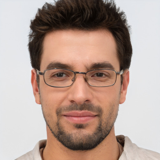 Joyful white adult male with short  brown hair and brown eyes