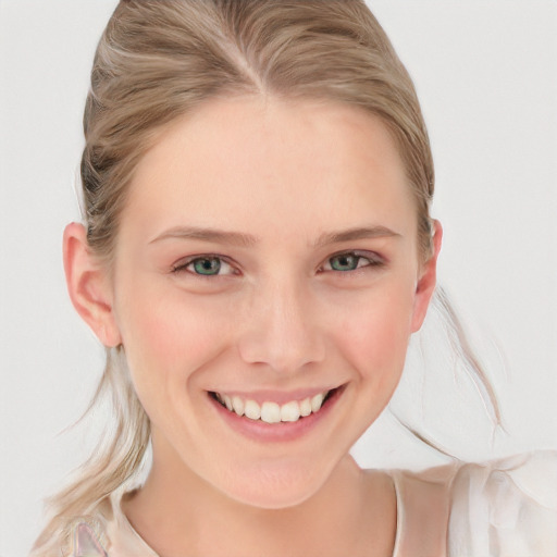 Joyful white young-adult female with long  blond hair and blue eyes