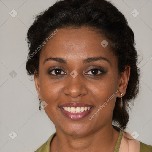 Joyful black adult female with medium  brown hair and brown eyes