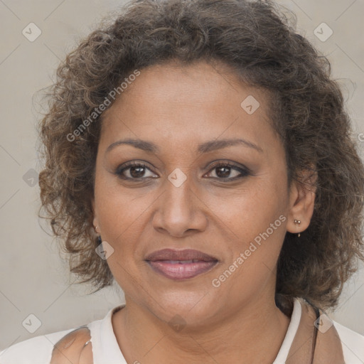 Joyful black adult female with medium  brown hair and brown eyes