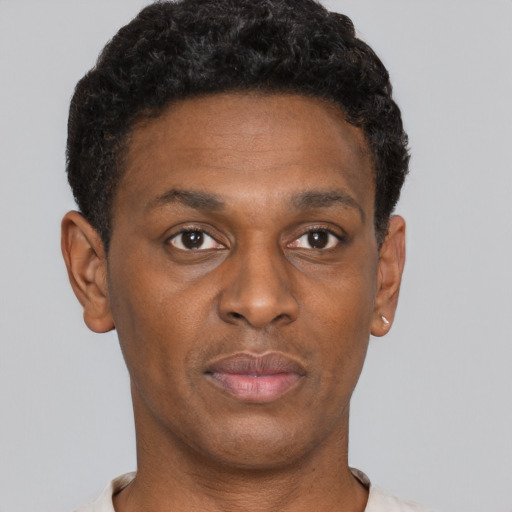 Neutral black young-adult male with short  brown hair and brown eyes