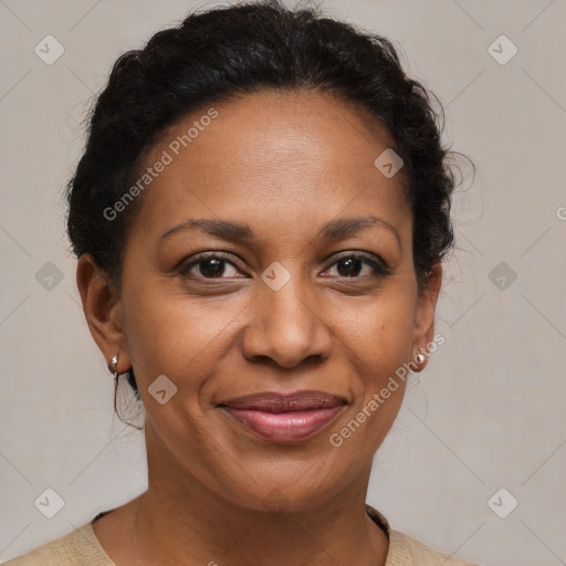 Joyful black adult female with medium  brown hair and brown eyes