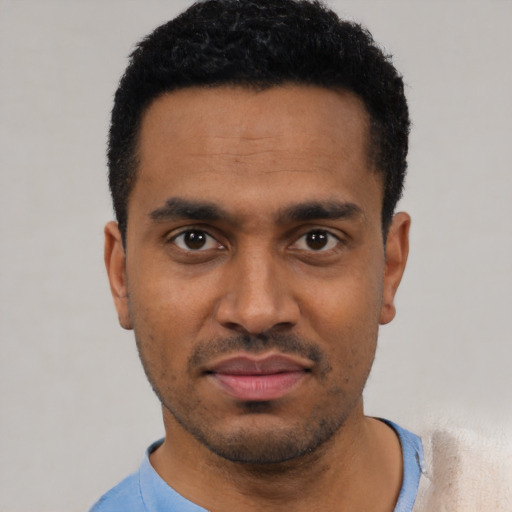 Neutral latino young-adult male with short  black hair and brown eyes