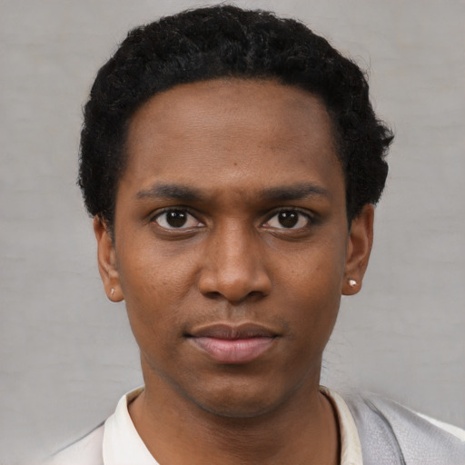 Neutral black young-adult male with short  black hair and brown eyes