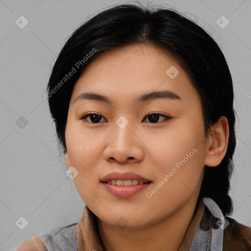 Joyful asian young-adult female with medium  black hair and brown eyes