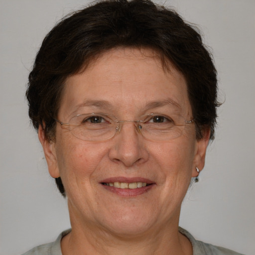 Joyful white middle-aged female with short  brown hair and brown eyes