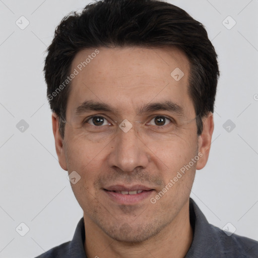 Joyful white adult male with short  black hair and brown eyes