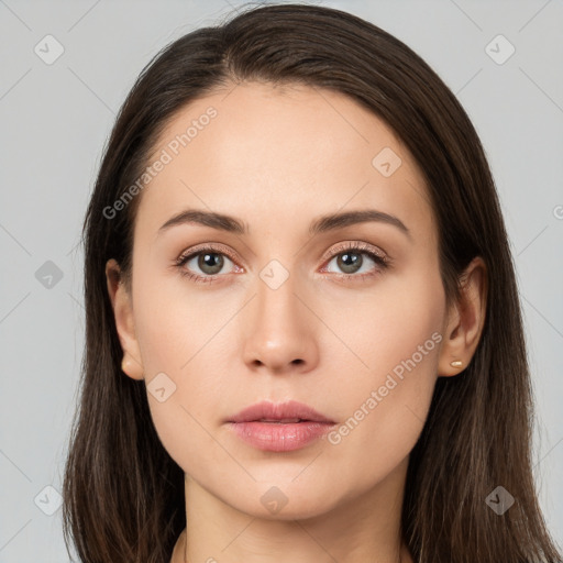 Neutral white young-adult female with long  brown hair and brown eyes