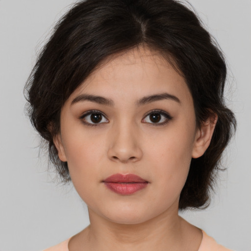 Neutral white young-adult female with medium  brown hair and brown eyes