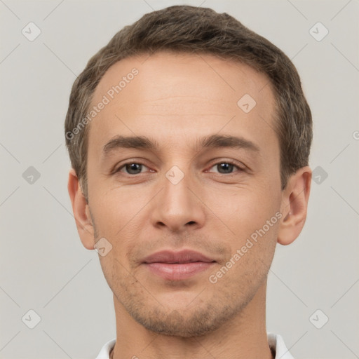 Joyful white young-adult male with short  brown hair and brown eyes