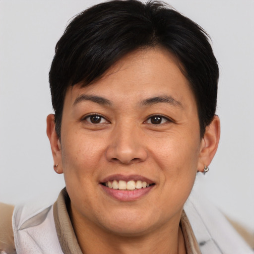 Joyful asian young-adult female with short  brown hair and brown eyes