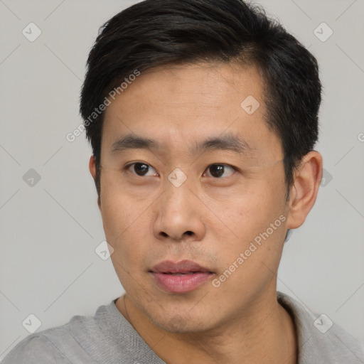 Neutral asian young-adult male with short  black hair and brown eyes