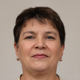 Joyful white adult female with short  brown hair and brown eyes