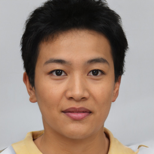 Joyful asian young-adult male with short  black hair and brown eyes