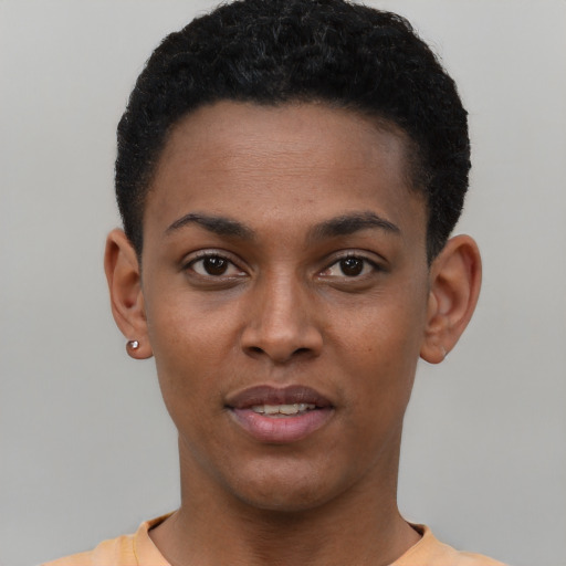 Joyful black young-adult male with short  black hair and brown eyes