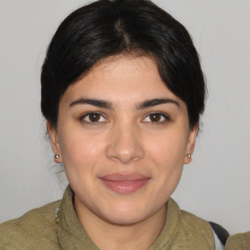 Joyful white young-adult female with medium  black hair and brown eyes