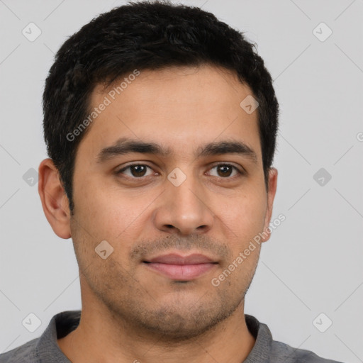 Joyful latino young-adult male with short  brown hair and brown eyes