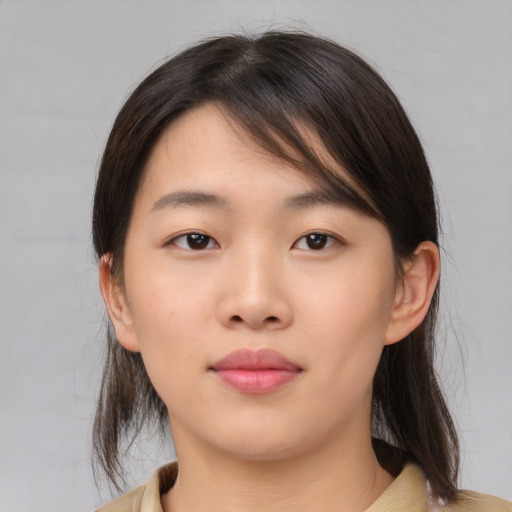 Neutral asian young-adult female with medium  brown hair and brown eyes