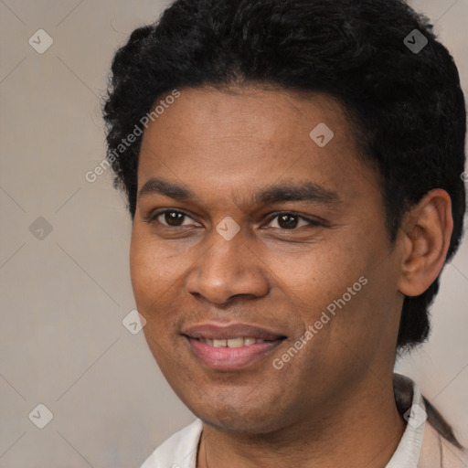 Joyful black young-adult male with short  black hair and brown eyes