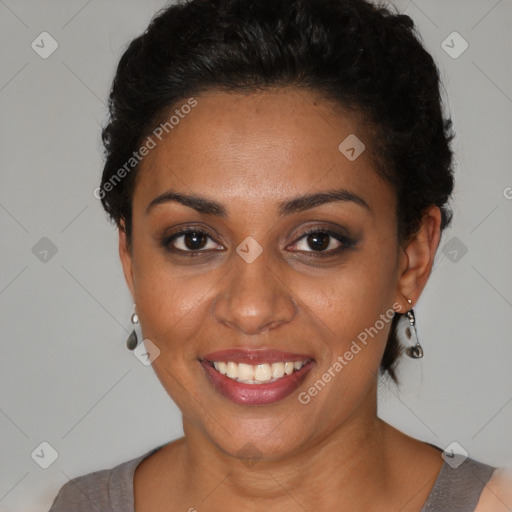 Joyful black young-adult female with short  brown hair and brown eyes