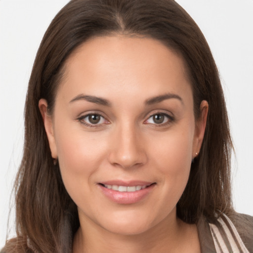 Joyful white young-adult female with long  brown hair and brown eyes