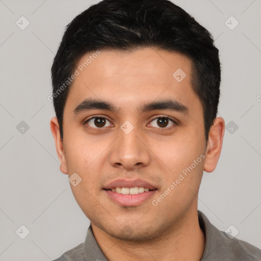 Joyful latino young-adult male with short  black hair and brown eyes