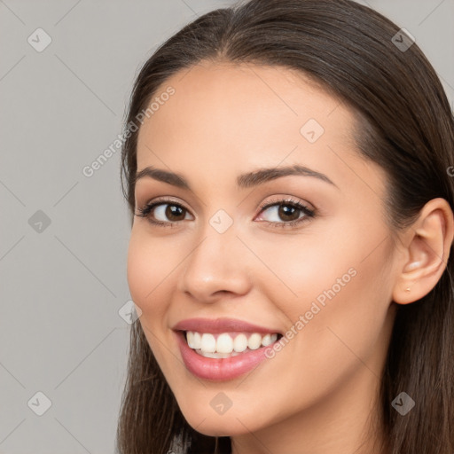 Joyful white young-adult female with long  brown hair and brown eyes