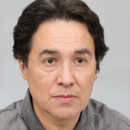 Joyful white middle-aged male with short  brown hair and brown eyes