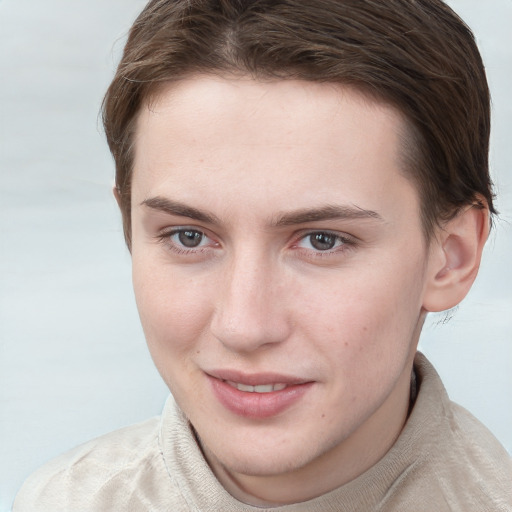 Joyful white young-adult female with short  brown hair and blue eyes