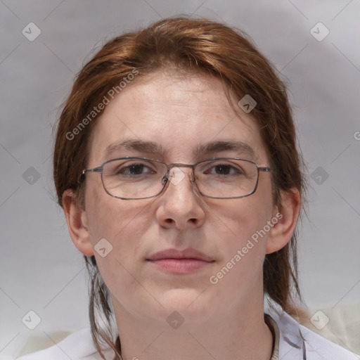 Joyful white adult female with medium  brown hair and grey eyes