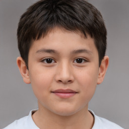 Joyful white child male with short  brown hair and brown eyes