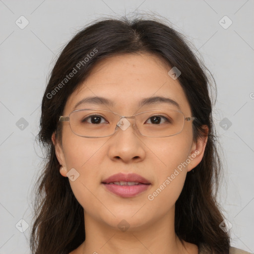 Joyful white adult female with long  brown hair and brown eyes