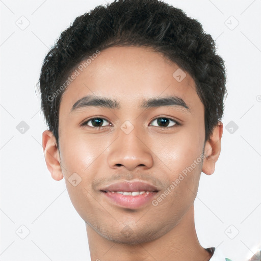 Joyful latino young-adult male with short  black hair and brown eyes