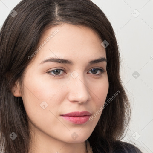 Neutral white young-adult female with long  brown hair and brown eyes