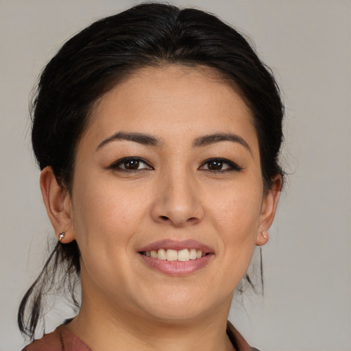 Joyful asian young-adult female with medium  brown hair and brown eyes