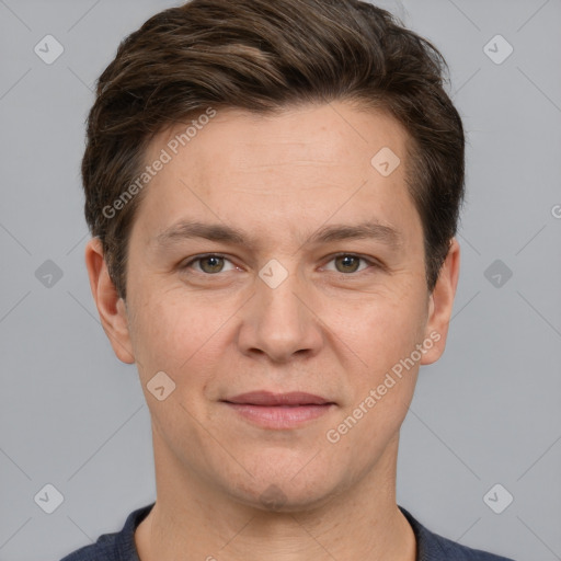 Joyful white adult male with short  brown hair and grey eyes