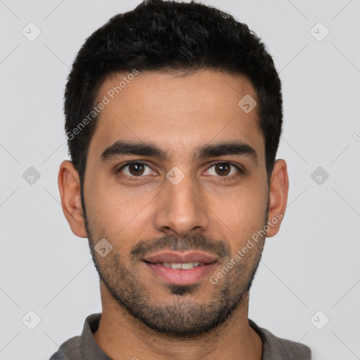 Joyful latino young-adult male with short  black hair and brown eyes