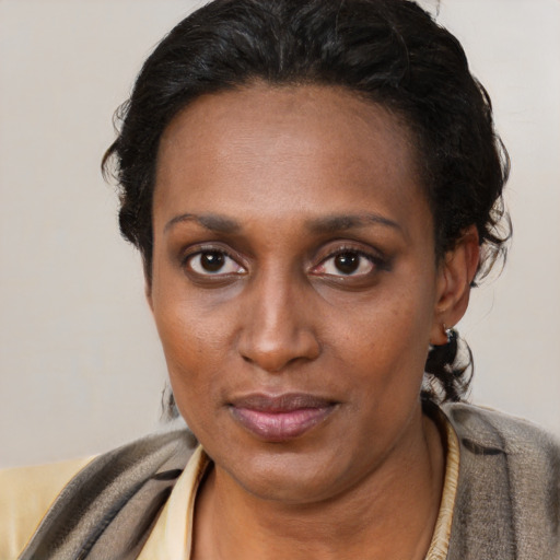 Neutral black young-adult female with short  black hair and brown eyes