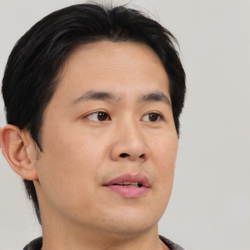 Neutral asian young-adult male with short  brown hair and brown eyes