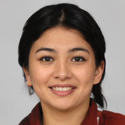 Joyful asian young-adult female with medium  black hair and brown eyes