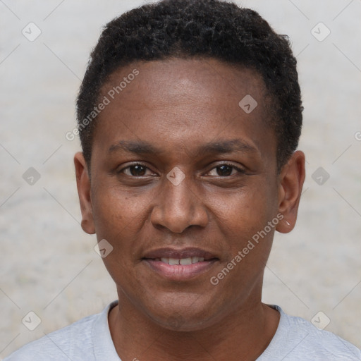 Joyful black young-adult male with short  brown hair and brown eyes