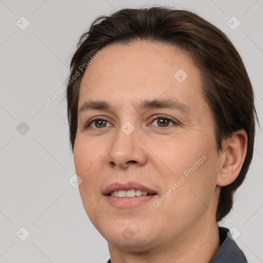 Joyful white adult female with short  brown hair and brown eyes