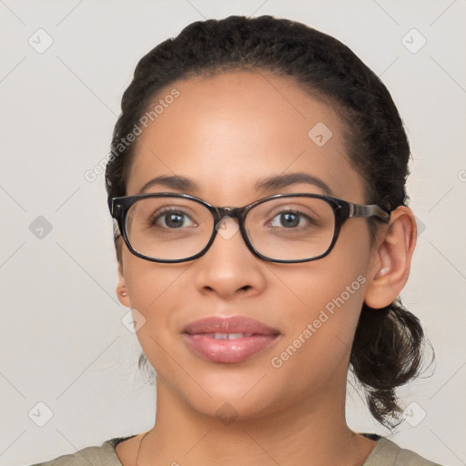 Joyful latino young-adult female with medium  brown hair and brown eyes